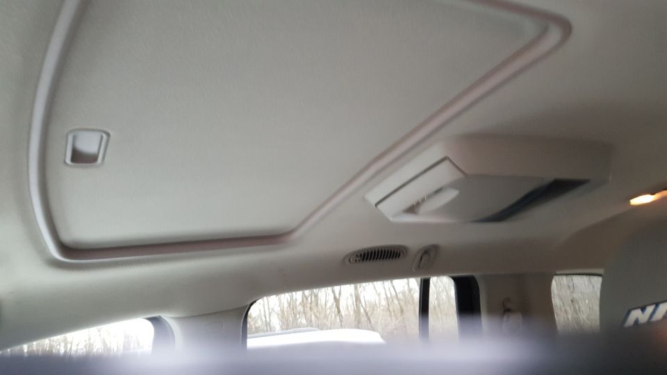 Interior view of a sunroof and overhead console in a vehicle