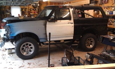 1995 Ford Bronco - This 1995 Ford Bronco is in a garage, appearing to be in the middle of a repair or customization process.