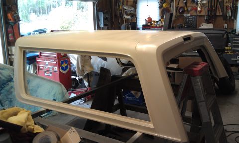 1995 Ford Bronco - Ford Bronco topper undergoing work in a garage setting.