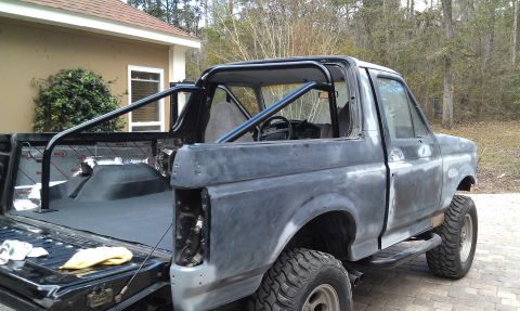 1995 Ford Bronco - This 1995 Ford Bronco is being prepped for paint, a custom roll cage and sound-deadening material in the bed.