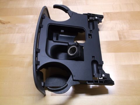 1995 Mercury Grand Marquis - This is a car interior part, likely a center console assembly, cup holders and a power outlet.