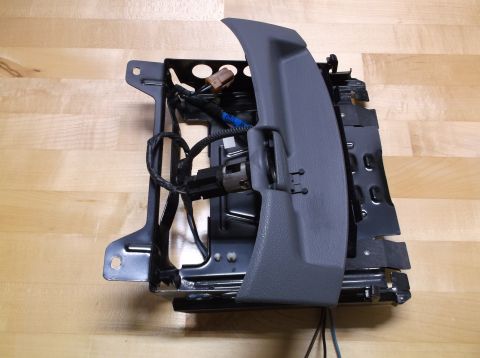 1995 Mercury Grand Marquis - A car seat mechanism with visible wiring and metal components is shown against a wooden background.
