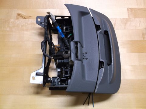 1995 Mercury Grand Marquis - A disassembled car interior part, likely from a dashboard or console, is shown with its internal wiring exposed.