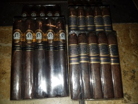 2018 Ford Bronco - Two boxes of cigars are displayed, one with Black Label branding and the other with Flores 1975 branding.