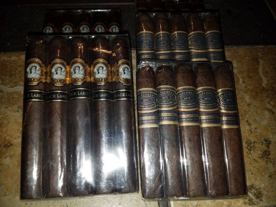 two boxes of cigars, one labeled Black Label, the other Flores 1975