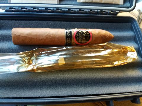 2018 Ford Bronco - A cigar is shown inside a protective case, with a gold-colored wrapper.