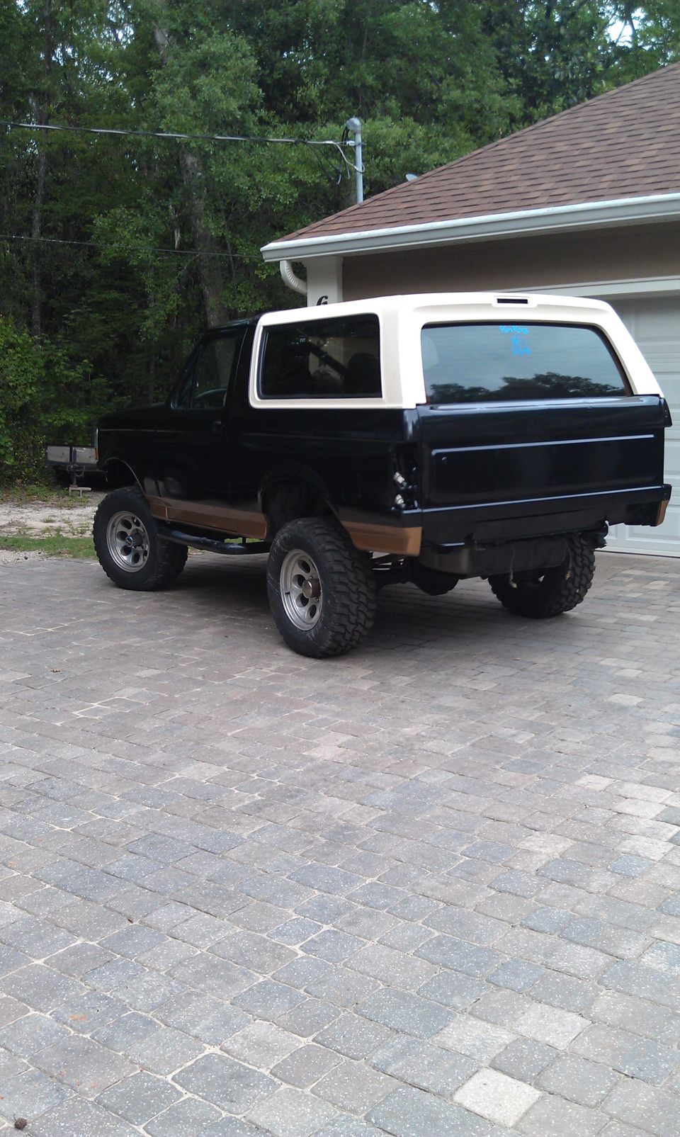 Black and white 1995 Ford Bronco, rear 3/4 view