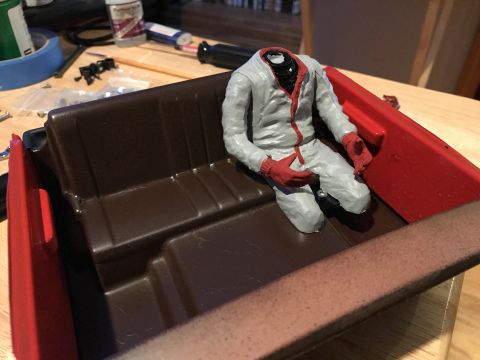 1989 Ford Bronco - Model car interior with a headless figure seated inside, possibly a custom build or diorama piece.