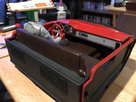 1989 Ford Bronco - Interior view of a model car, possibly a Dinky toy, showing the dashboard and seating area.
