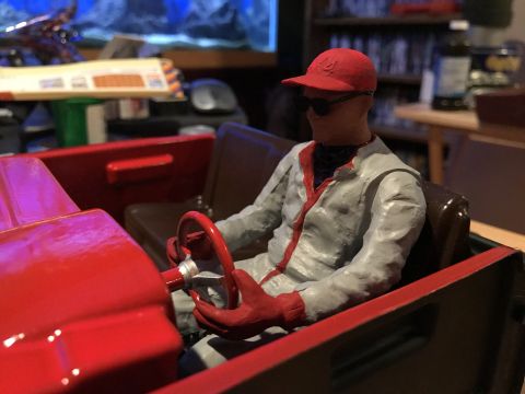 1989 Ford Bronco - A close-up view of a model car's interior a driver figure.