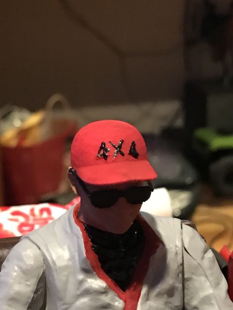 1989 Ford Bronco - A figure sports a red cap and sunglasses, with "4X4" visible on the cap.