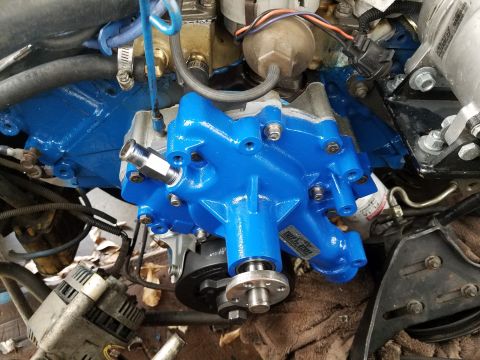 1976 Ford Ranchero - Engine water pump assembly, likely a replacement part, with visible hoses and fittings.