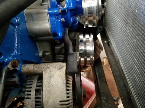 1976 Ford Ranchero - Close-up view of engine components including pulleys, alternator, and radiator.