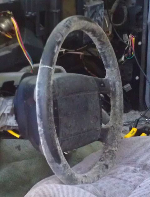 1995 Ford Bronco - Steering wheel and dashboard components are visible in this close-up shot.