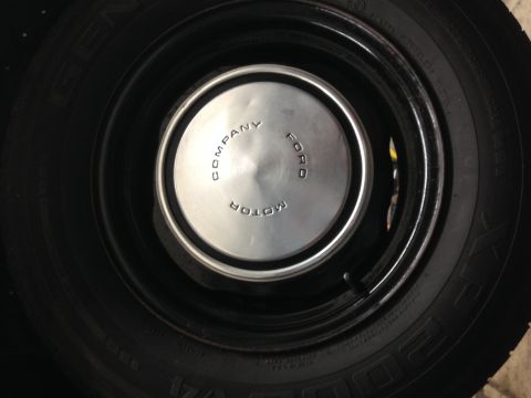 1988 Ford Crown Victoria LTD - Close-up of a Ford Motor Company hubcap on a tire.