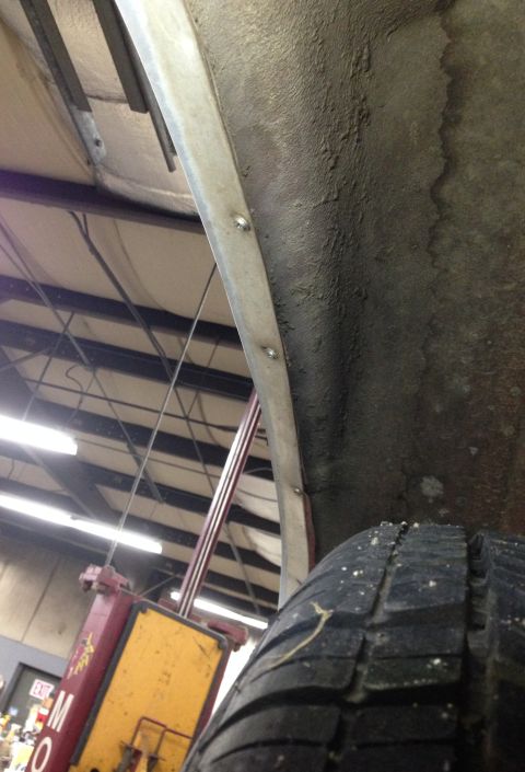 1988 Ford Crown Victoria LTD - Close-up view of a vehicle's tire and inner fender well, with visible text from a website in the lower right corner.