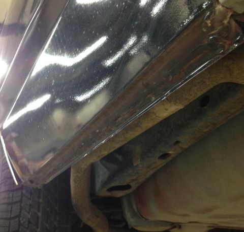1988 Ford Crown Victoria LTD - Underside view of a 1988 Ford Crown Victoria LTD, highlighting the rocker panel and frame structure.