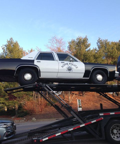 1988 Ford Crown Victoria LTD - A 1988 Ford Crown Victoria police car is seen on a car carrier, displaying 'Rome Police' markings.