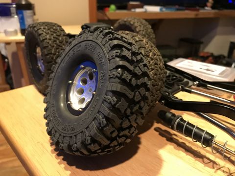 1989 Ford Bronco - Close-up of RC car tires and suspension parts, not a 1989 Ford Bronco.