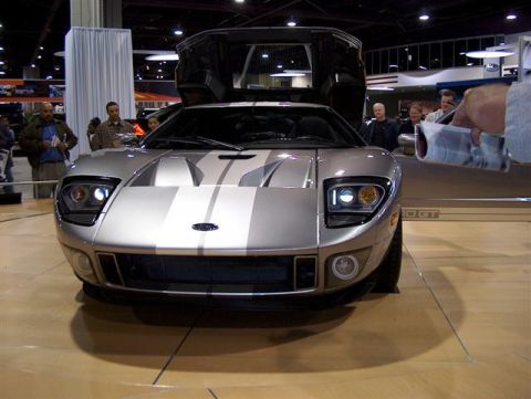 2001 Ford Crown Victoria - Silver Ford GT sports car on display with its distinctive butterfly doors open.