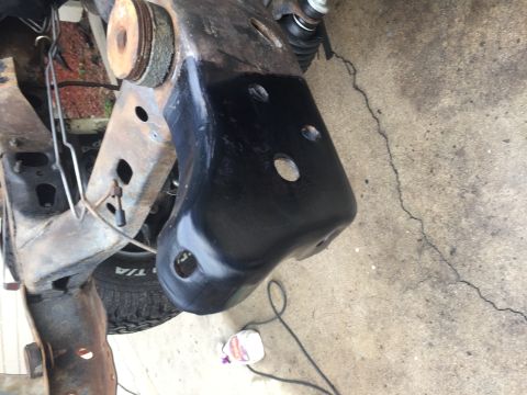 1978 Ford Bronco - This image shows a close-up view of vehicle frame and suspension components, with some parts recently painted black.