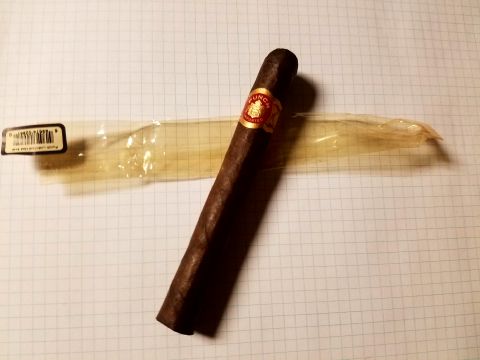 2018 Ford Bronco - A cigar rests on graph paper, accompanied by its plastic wrapper.