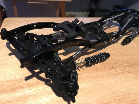 1989 Ford Bronco - This is a close-up view of an RC car chassis, its suspension system with shocks and springs.