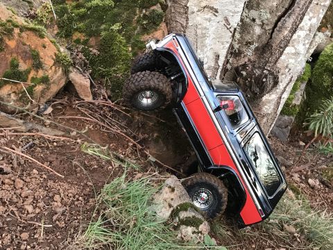 1989 Ford Bronco - This remote-controlled truck navigates a challenging, rocky path, its off-road capabilities.