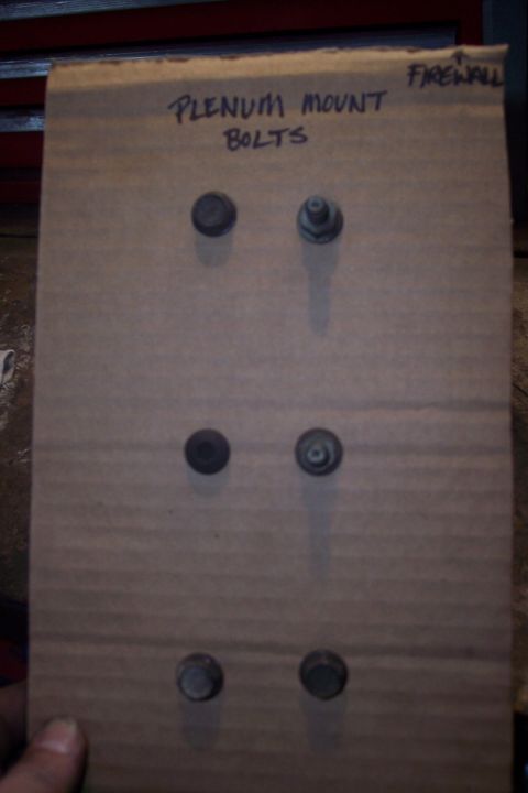 1995 Ford Bronco - A piece of cardboard with six bolts attached to it. Text written on the cardboard reads "PLENUM MOUNT BOLTS" and "FIREWALL".