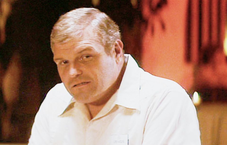 Man in a white shirt with a name tag