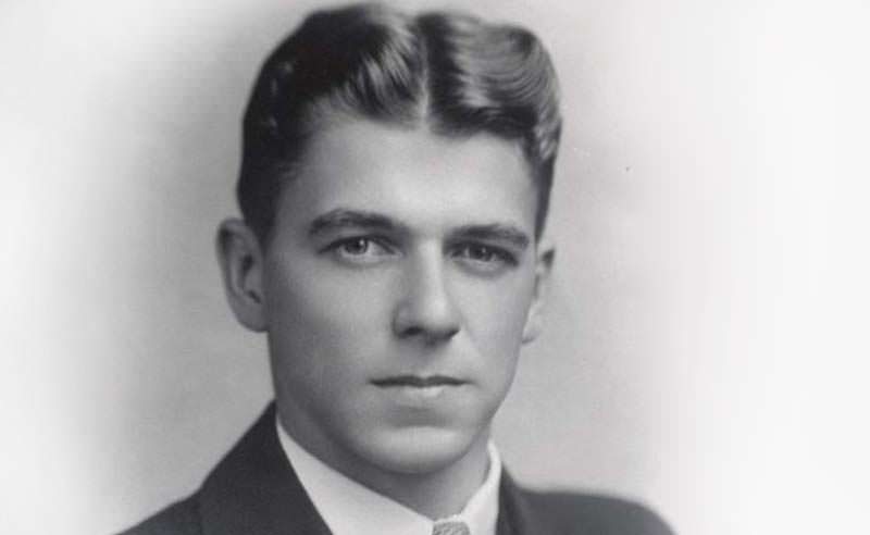 Young man with slicked-back hair and a suit