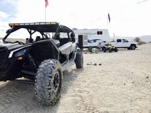 1988 Ford Bronco - Desert scene with a UTV, trailer, and pickup truck.
