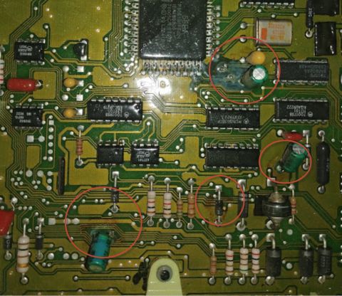 1992 Ford Bronco - This is a close-up view of an electronic circuit board, showing many components and their connections.