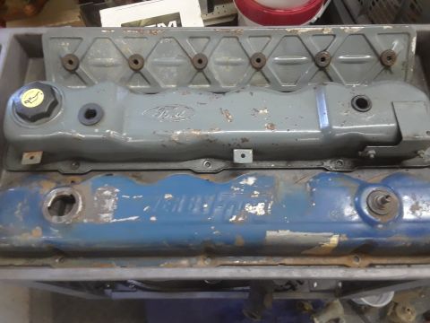 1985 Ford Bronco - Two Ford engine valve covers, one gray and one blue, are shown in a registry photo.
