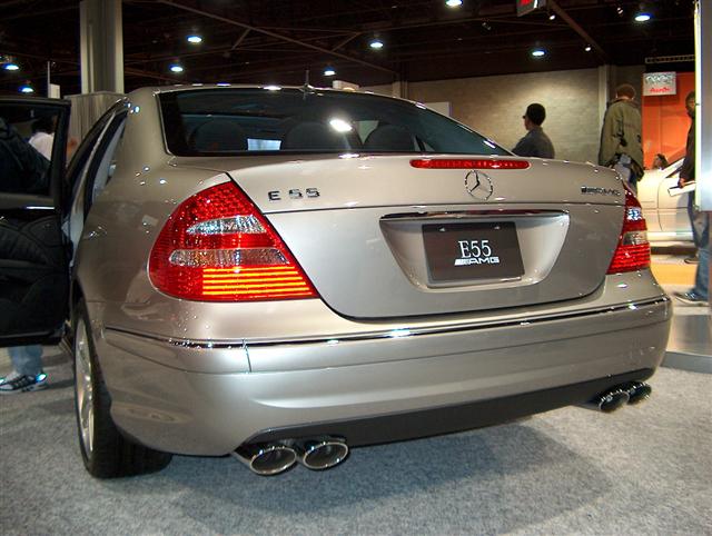 Silver Mercedes-Benz E55 AMG rear view with quad exhaust pipes
