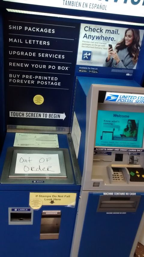1994 Subaru Legacy - USPS self-service kiosks are shown, with one machine displaying an 'Out of Order' sign.