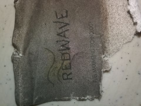 1993 Ford Bronco - A torn piece of material displays the text REDWAVE and FUEL MAXIMIZING TECHNOLOGY.
