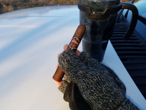 2018 Ford Bronco - Enjoying a cigar and coffee from a travel mug on the hood of a vehicle.