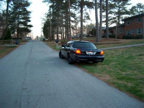 2001 Ford Crown Victoria - Rear view of a 2001 Ford Crown Victoria parked on a quiet street.