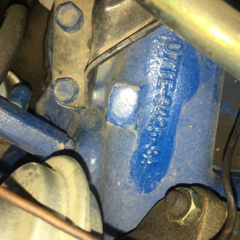 1979 Ford Ranchero - Casting numbers are stamped onto a blue painted component, likely from an engine or drivetrain.