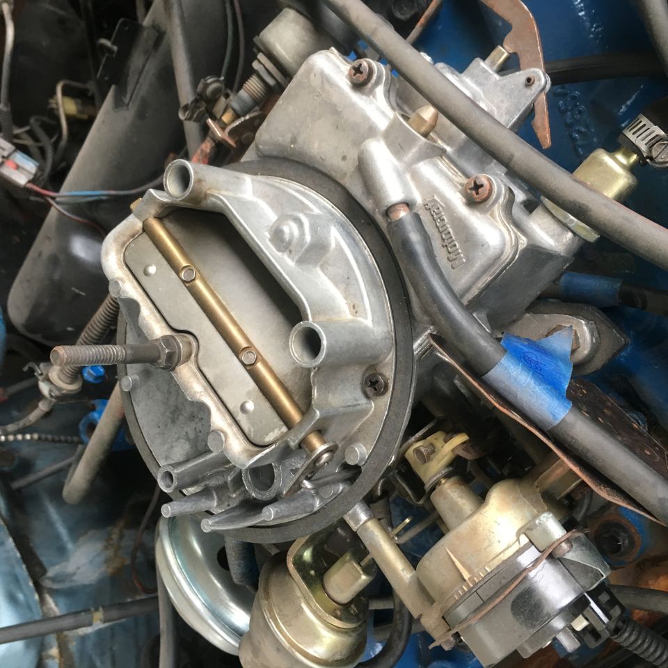 Carburetor with visible "Motorcraft" text