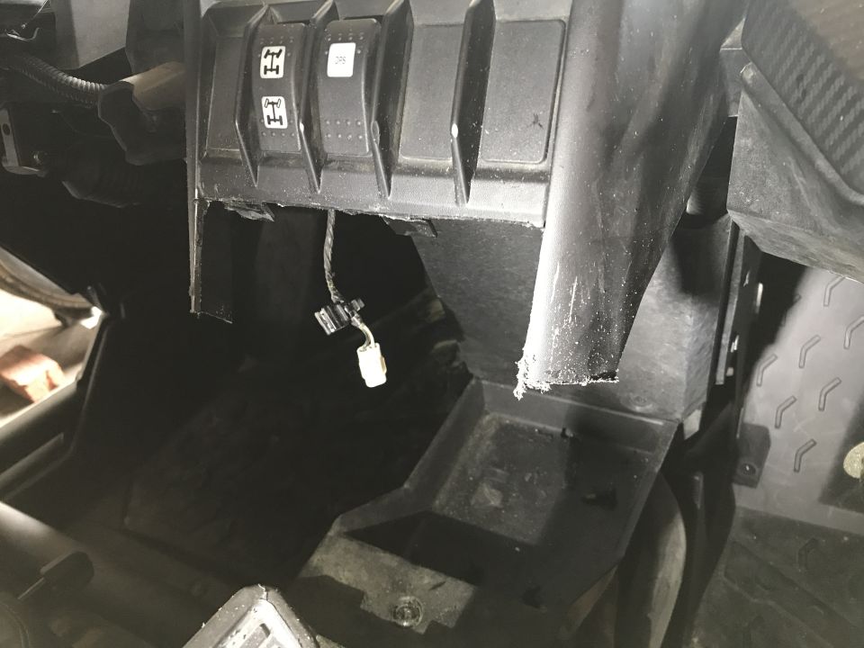 Dashboard interior with four-wheel drive selector buttons and exposed wiring