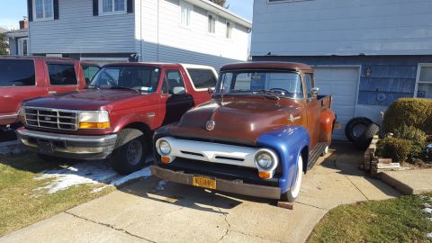 1967 Ford Bronco - Three vehicles parked in a driveway, including a vintage Ford pickup and a Ford Bronco.