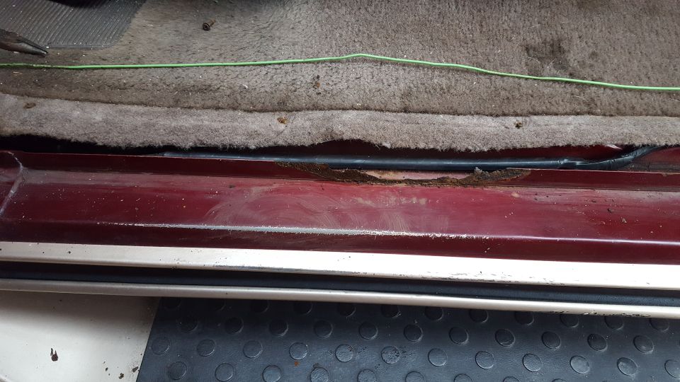 1967 Ford Bronco interior door sill showing rust