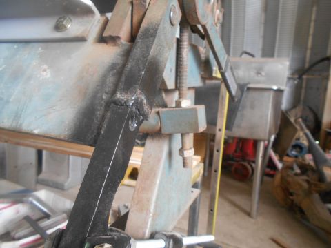 1992 Ford Bronco - Close-up view of metal fabrication equipment, showing welds and bolted components.