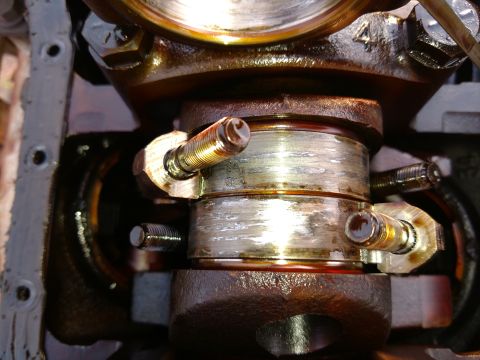1996 Ford Bronco - Close-up of a worn engine crankshaft bearing, indicating potential internal engine work.