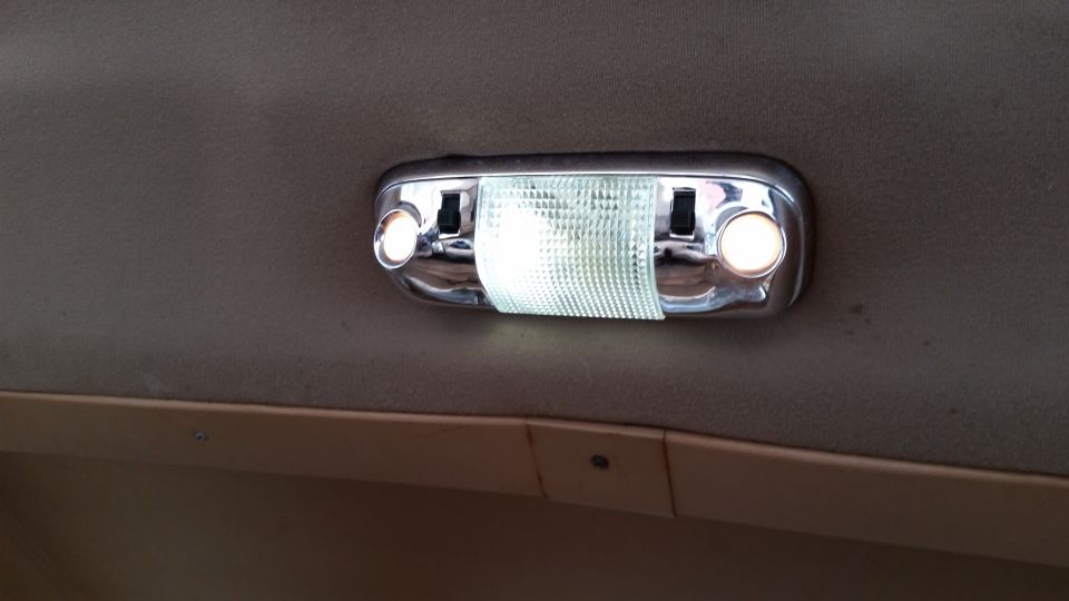 Interior dome light with chrome trim and textured lens