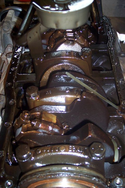 1995 Ford Bronco - This is a close-up, high-angle shot of the internal components of a V8 engine, likely a Ford 5.0L, showing the crankshaft, connecting rods,…