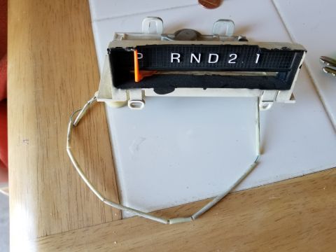 1967 Ford Bronco - A close-up view of a vintage automatic transmission gear indicator. The indicator shows the selector is in the 'P' (Park) position, with th…