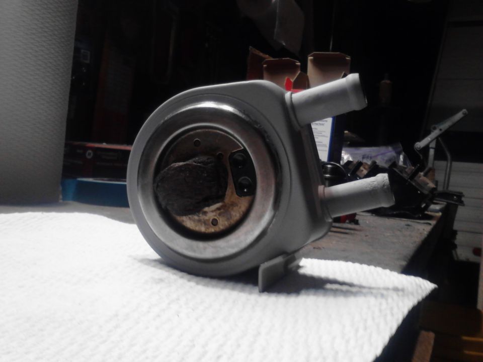 Gray automotive part with hose fittings and internal material